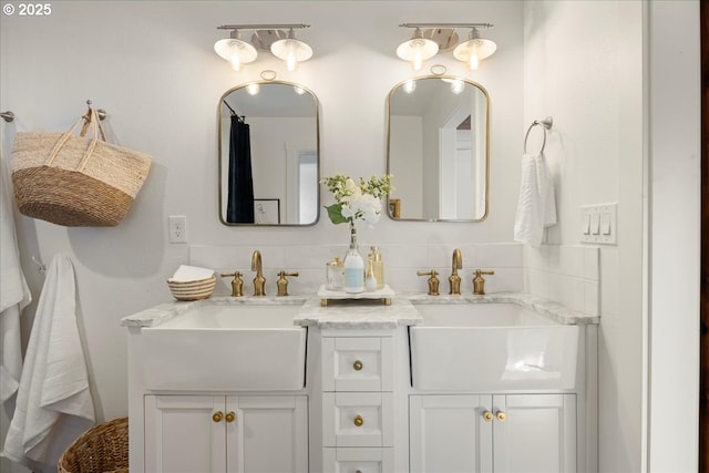 bathroom featuring decorative backsplash and vanity