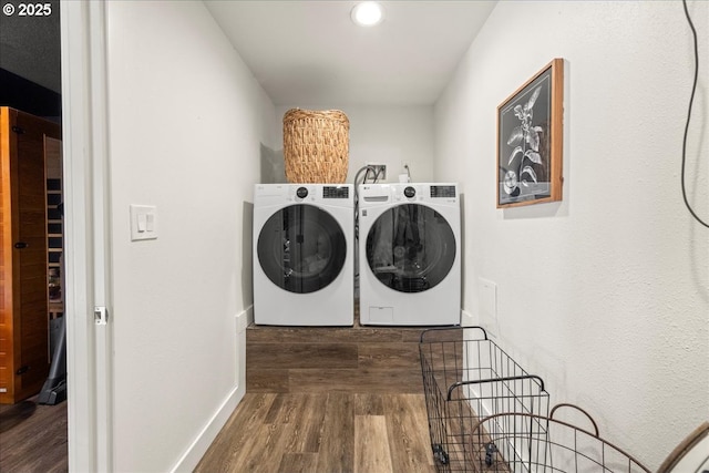 laundry area featuring dark hardwood / wood-style floors and separate washer and dryer