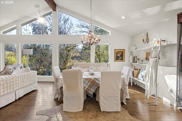 dining space with hardwood / wood-style floors, vaulted ceiling with beams, a healthy amount of sunlight, and a chandelier