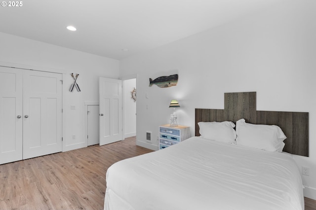 5769 NW Logan Rd, Lincoln City, OR 97367 - bedroom featuring wood finished floors, baseboards, and recessed lighting
