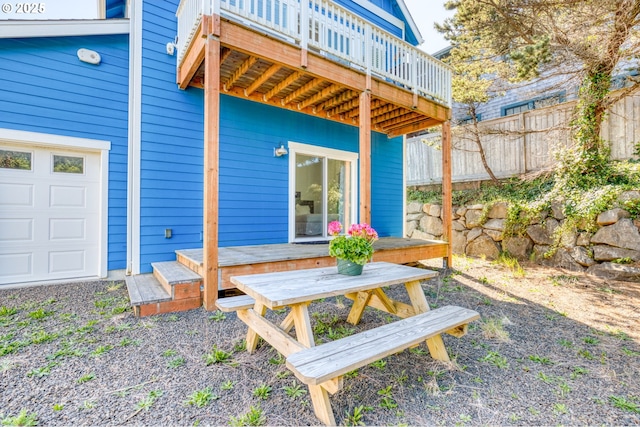 5769 NW Logan Rd, Lincoln City, OR 97367 - view of patio / terrace featuring a wooden deck and a garage