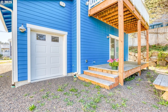 5769 NW Logan Rd, Lincoln City, OR 97367 - doorway to property featuring a deck, fence, and a garage