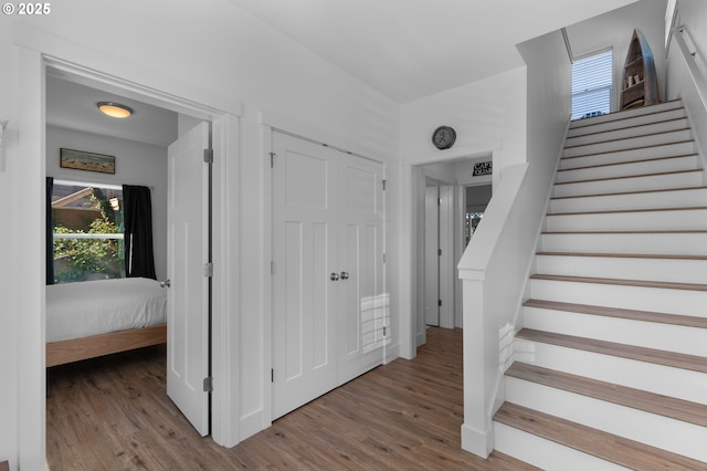5769 NW Logan Rd, Lincoln City, OR 97367 - staircase featuring wood finished floors