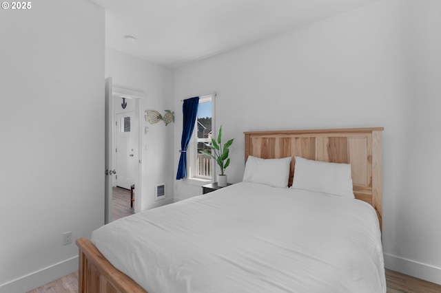 5769 NW Logan Rd, Lincoln City, OR 97367 - bedroom featuring baseboards and light wood finished floors