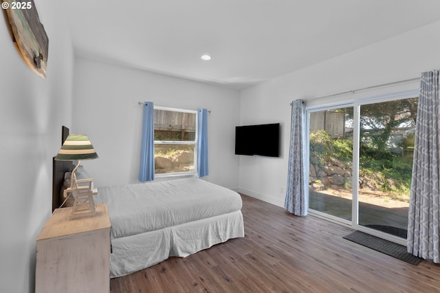 5769 NW Logan Rd, Lincoln City, OR 97367 - bedroom with wood finished floors, access to exterior, baseboards, and recessed lighting