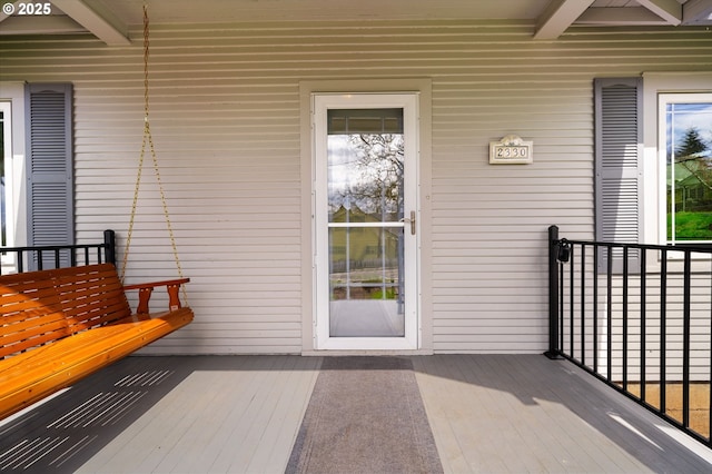 entrance to property with a balcony