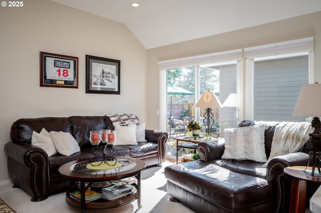 carpeted living area with lofted ceiling and recessed lighting