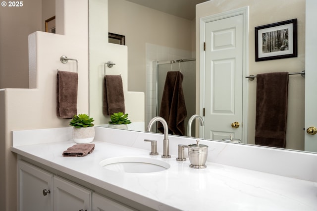 bathroom with a stall shower and vanity