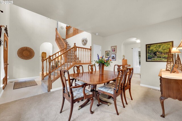 dining room featuring light colored carpet