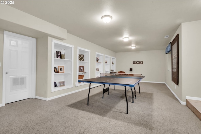 rec room featuring carpet and built in shelves