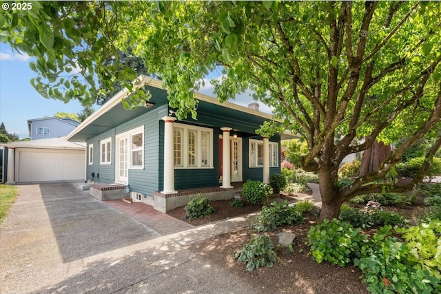7406 N Fiske Ave, Portland, OR 97203 - view of front of home with an outbuilding, a garage, and asphalt driveway