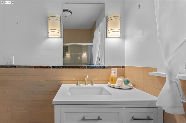 7406 N Fiske Ave, Portland, OR 97203 - bathroom featuring vanity, a shower with shower door, and decorative backsplash