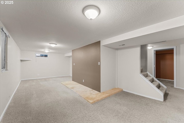 7406 N Fiske Ave, Portland, OR 97203 - finished below grade area with carpet flooring, a textured ceiling, and stairway