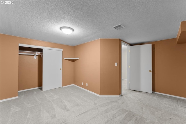 7406 N Fiske Ave, Portland, OR 97203 - unfurnished bedroom with a textured ceiling, carpet flooring, and a closet