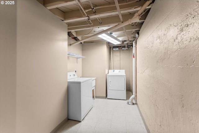 7406 N Fiske Ave, Portland, OR 97203 - washroom with washing machine and dryer and light flooring