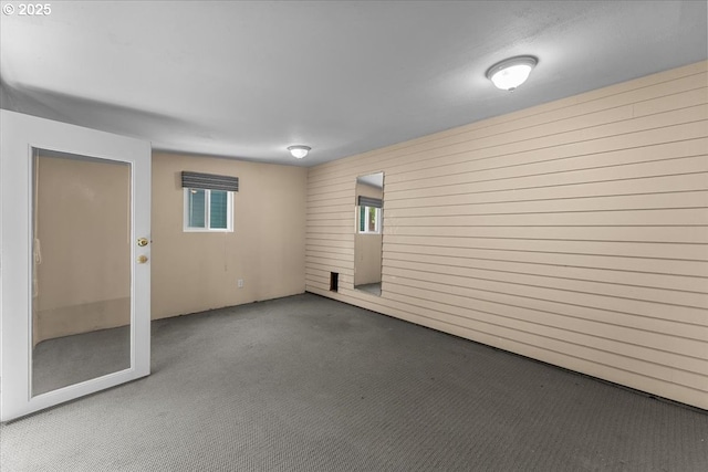 7406 N Fiske Ave, Portland, OR 97203 - carpeted spare room featuring wood walls