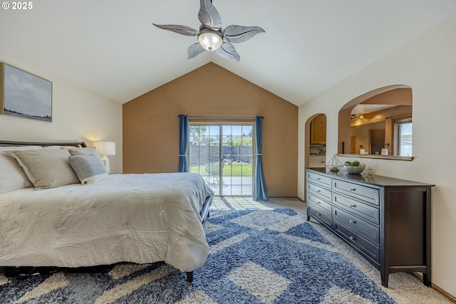 bedroom featuring access to outside, light carpet, arched walkways, a ceiling fan, and lofted ceiling