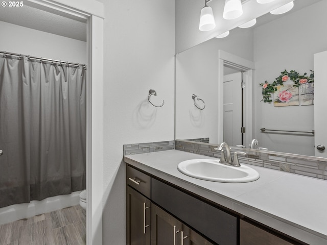 4745 S 19th St, Ridgefield, WA 98642 - bathroom featuring backsplash, toilet, shower / bath combination with curtain, and vanity