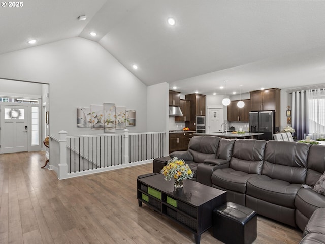 4745 S 19th St, Ridgefield, WA 98642 - living area with high vaulted ceiling, recessed lighting, and light wood-style flooring