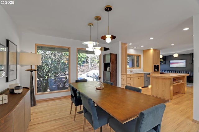 dining space featuring recessed lighting and light wood-style floors