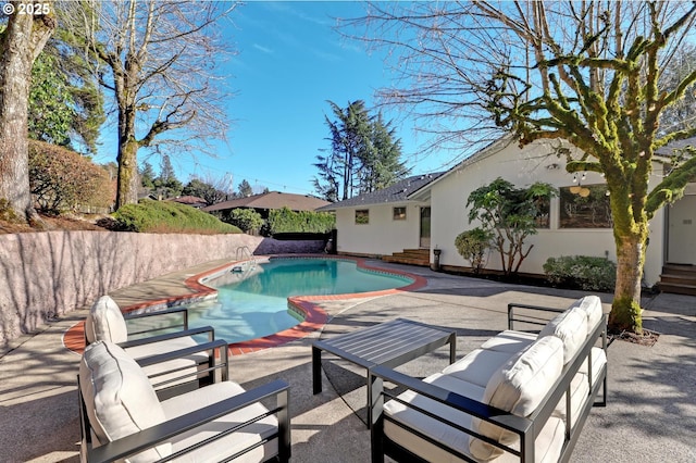 view of pool featuring entry steps, a patio, outdoor lounge area, and a fenced in pool