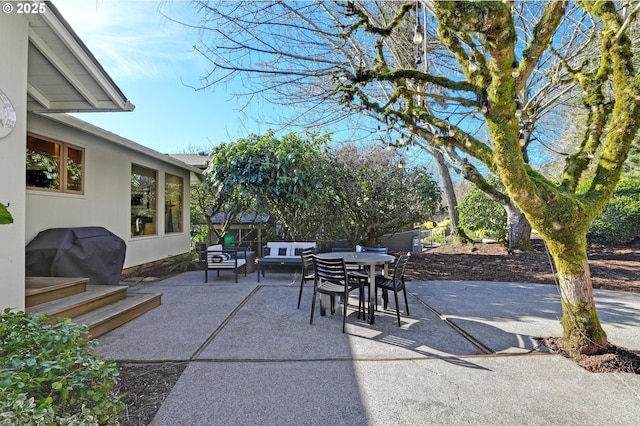 view of patio featuring outdoor lounge area and a grill