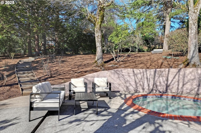 view of pool featuring a patio area, an outdoor living space, and an in ground hot tub