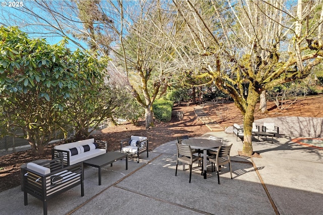 view of patio featuring outdoor dining area and an outdoor living space