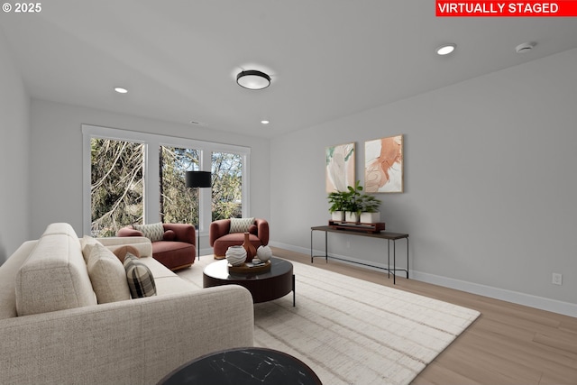 living room with light hardwood / wood-style floors