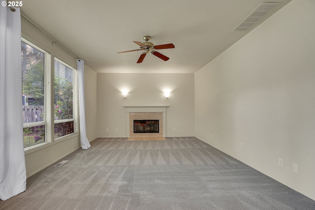 4698 Black Forest Ct, Lake Oswego, OR 97035 - unfurnished living room with light carpet, a ceiling fan, and a tile fireplace