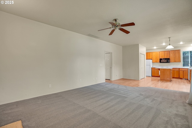 4698 Black Forest Ct, Lake Oswego, OR 97035 - unfurnished living room featuring light colored carpet, a ceiling fan, and recessed lighting