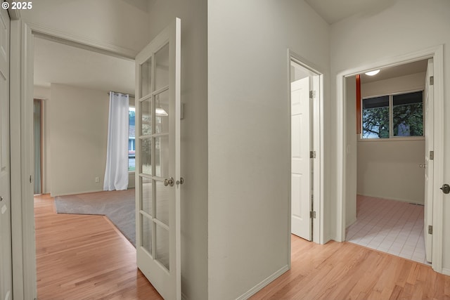 4698 Black Forest Ct, Lake Oswego, OR 97035 - corridor with wood finished floors, french doors, and baseboards