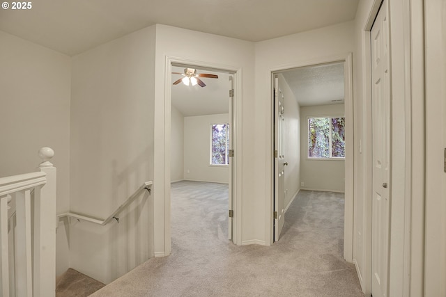 4698 Black Forest Ct, Lake Oswego, OR 97035 - hallway with an upstairs landing, light colored carpet, and baseboards