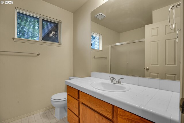 4698 Black Forest Ct, Lake Oswego, OR 97035 - full bathroom with a shower with door, toilet, vanity, baseboards, and tile patterned floors