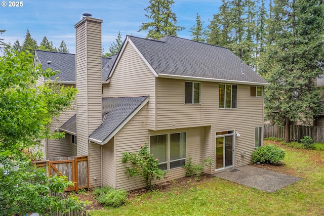 4698 Black Forest Ct, Lake Oswego, OR 97035 - back of house featuring a chimney, a shingled roof, and a patio