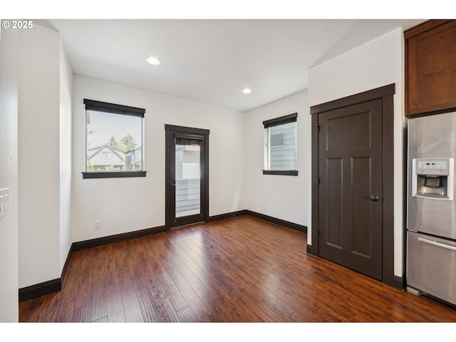 unfurnished room with baseboards, recessed lighting, and dark wood-type flooring