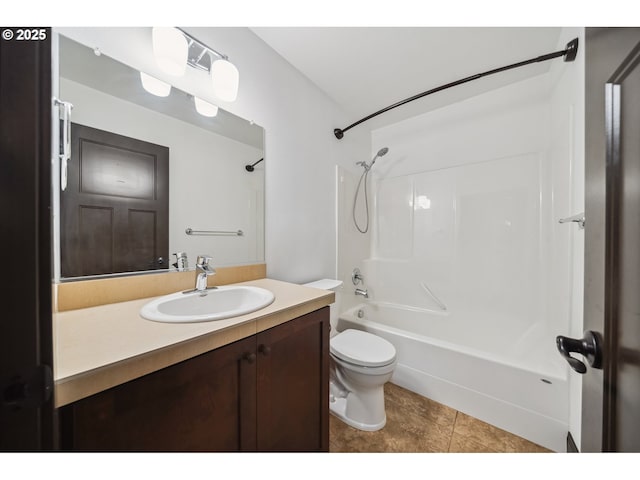 full bath featuring tile patterned floors, shower / bathing tub combination, vanity, and toilet