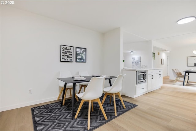 dining area featuring light hardwood / wood-style flooring