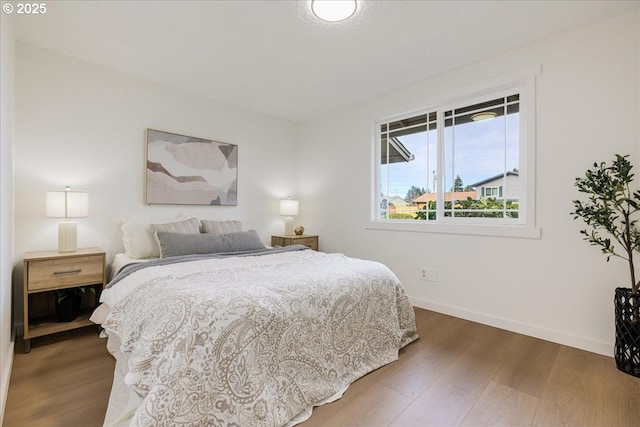 bedroom featuring dark wood-type flooring