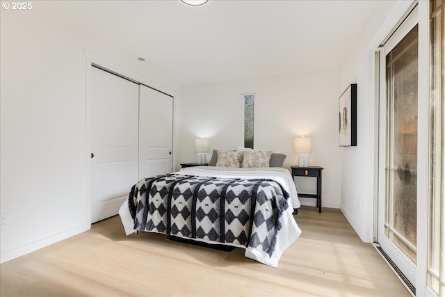 bedroom with a closet and light wood-type flooring