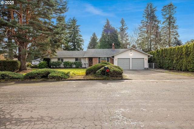 ranch-style home featuring a garage