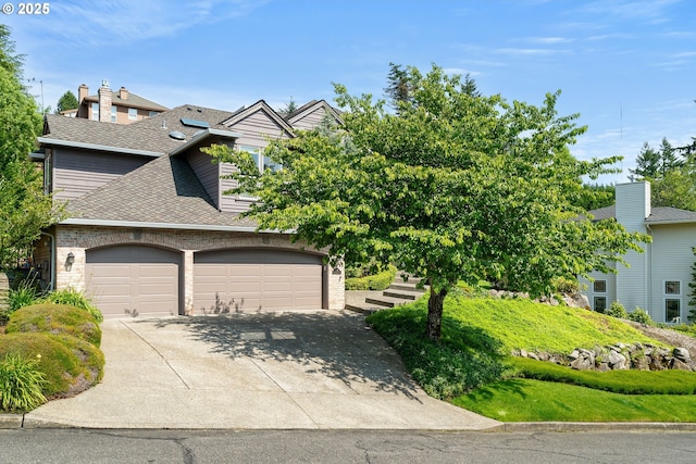 1314 NW Abernethy Rd, Portland, OR 97229 - view of front of house with roof with shingles and concrete driveway