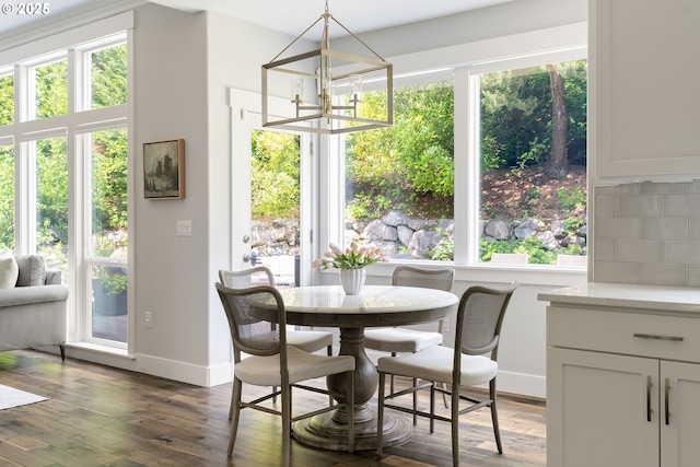 1314 NW Abernethy Rd, Portland, OR 97229 - dining space featuring a chandelier, dark wood-style flooring, and plenty of natural light
