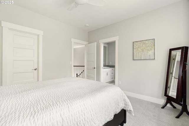 1314 NW Abernethy Rd, Portland, OR 97229 - bedroom featuring light colored carpet, ensuite bathroom, and a ceiling fan