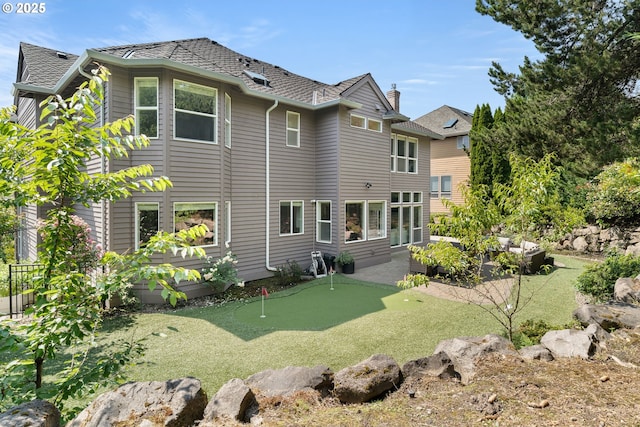 1314 NW Abernethy Rd, Portland, OR 97229 - back of property with a putting area and a patio area