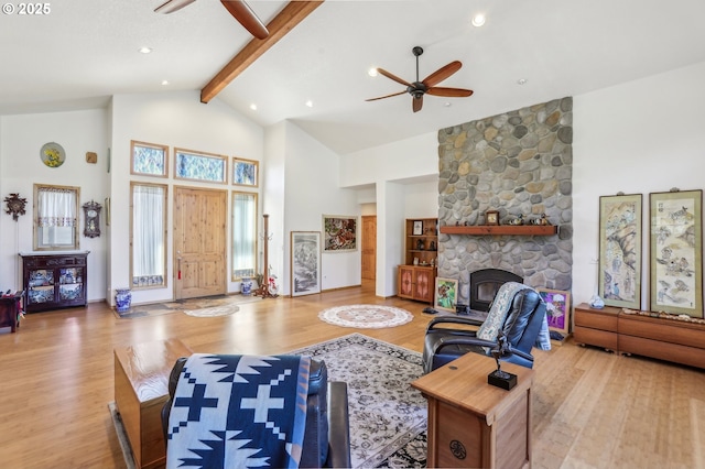 52135 E Terra Fern Dr, Sandy, OR 97055 - living room with ceiling fan, high vaulted ceiling, wood finished floors, beamed ceiling, and a fireplace