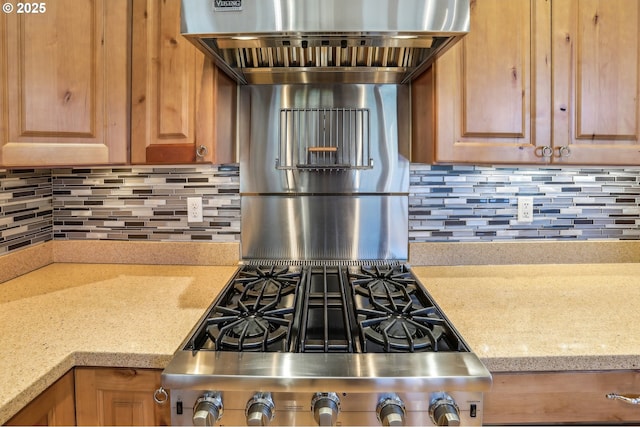 52135 E Terra Fern Dr, Sandy, OR 97055 - kitchen with tasteful backsplash, light stone counters, and exhaust hood