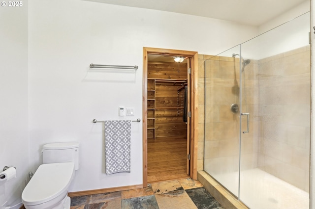 52135 E Terra Fern Dr, Sandy, OR 97055 - full bathroom with a shower stall, a walk in closet, and stone finish floors