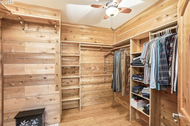 52135 E Terra Fern Dr, Sandy, OR 97055 - walk in closet featuring wood finished floors and a ceiling fan