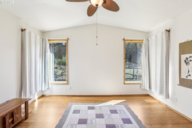 52135 E Terra Fern Dr, Sandy, OR 97055 - empty room with wood finished floors, a ceiling fan, and vaulted ceiling